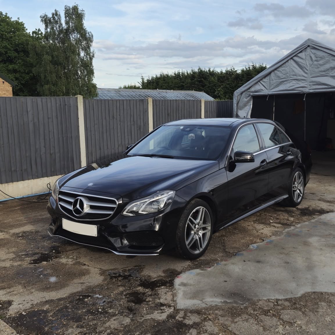 Glossy black Mercedes E-Class AMG Line after a full detail and ceramic protection at Tailored Detail, Hockley Essex