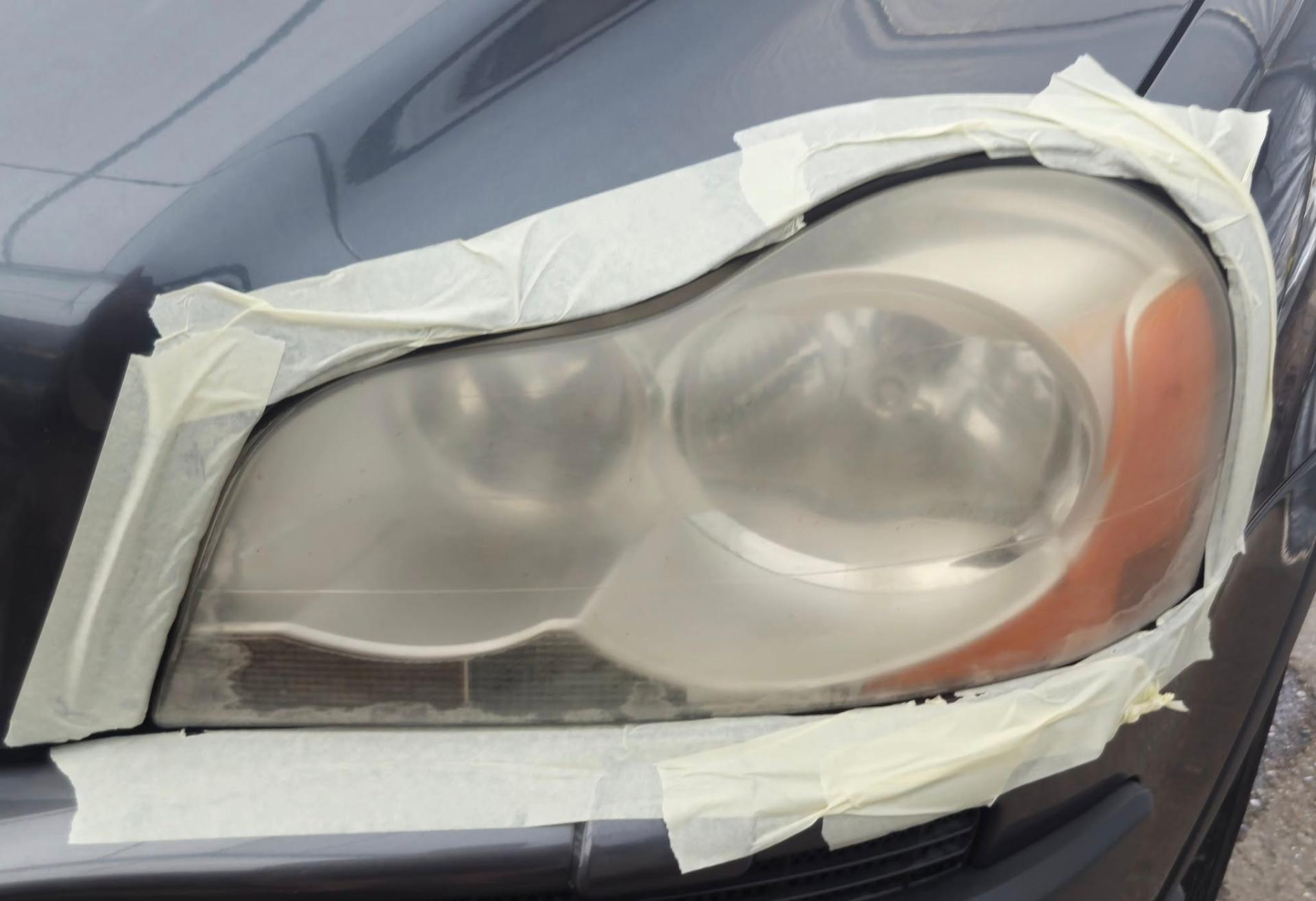 Hazy, oxidised headlight lens on a Volvo before restoration by Tailored Detail, Hockley Essex