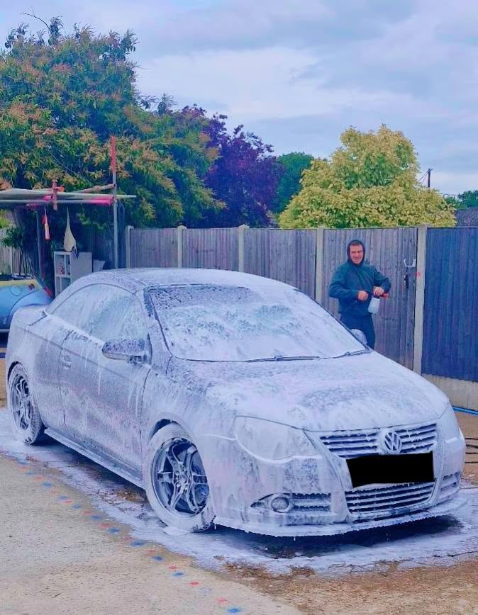 VW Eos convertible covered in snow foam during exterior deep clean