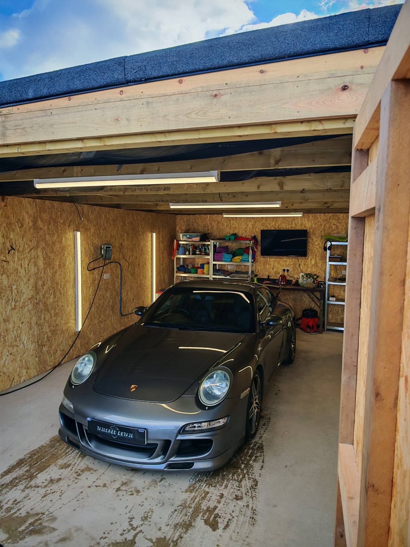 Grey Porsche 911 inside the Tailored Detail indoor studio after a full detail, Hockley Essex